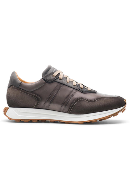 A dark brown athletic sneaker from the Magnanni Romero II in Grey/Taupe collection, featuring light tan laces, a white sole with brown tread, and subtle stripe detailing on the side.