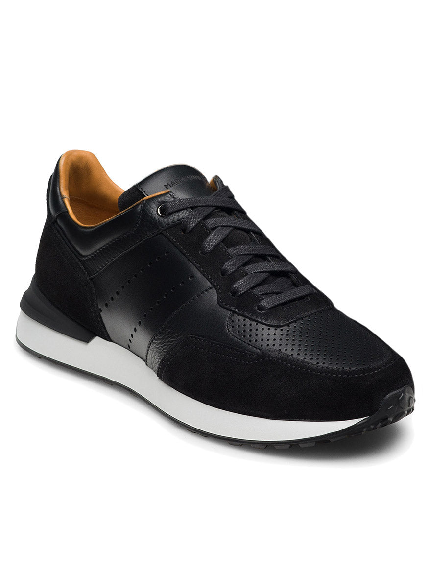 The Magnanni Sona III in Black is an athletic shoe featuring a white sport sole, perforated detailing, and a combination of leather and suede materials. These shoes come with black laces and the Tech Runner design, offering both sleek aesthetics and high performance.