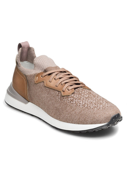 The Magnanni Stratus LyteKnit in Torba is a brown knit sneaker featuring a knitted fabric upper, white sport sole, and brown leather accents. The shoe includes laces, a pull tab on the heel, and a cushioned footbed for added comfort.