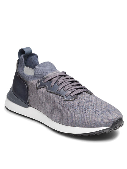 The Magnanni Stratus LyteKnit in Indigo features a cushioned footbed, lace-up closure, white midsole, and black textured outsole, displayed against a white background.