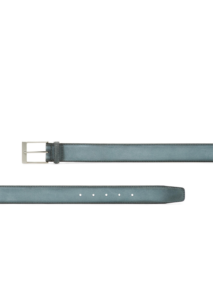 The Magnanni Telante Belt in sky blue suede features a supple leather finish, a silver rectangular buckle, and multiple adjustment holes, displayed flat on a white background.