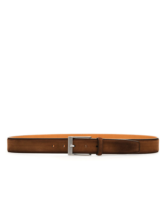 The Magnanni Telante Belt in Cognac Suede boasts rich suede leather with a sleek brushed nickel buckle, elegantly showcased on a white background.