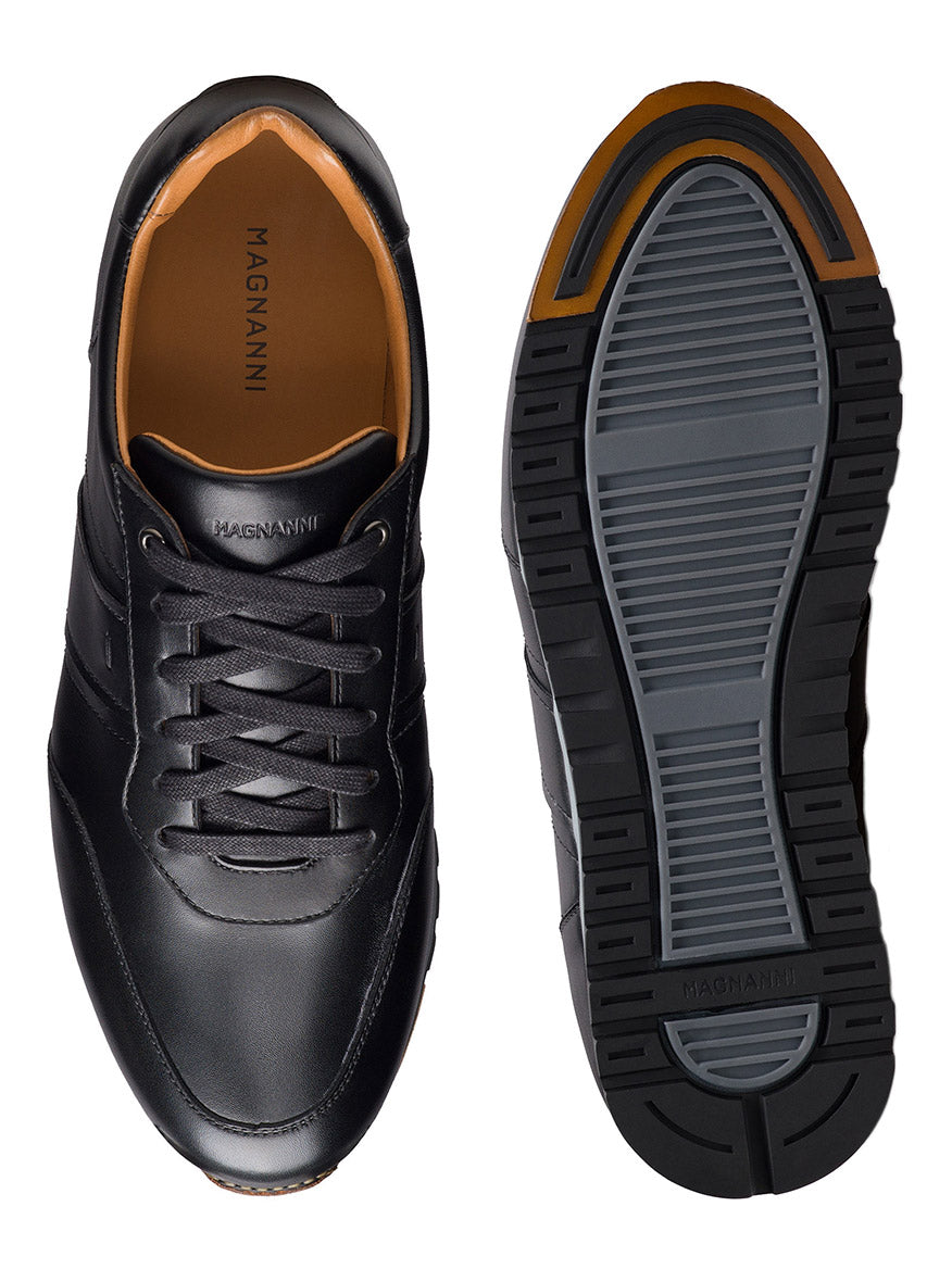The Magnanni Ventura in Black men’s leather sneakers are shown from the top and sole, featuring laces and a rubber outsole with gray and black tread.