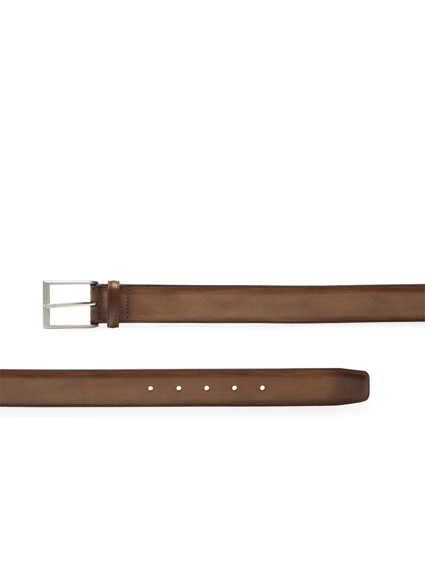 The Magnanni Viento Belt in Torba features brown calfskin leather and a silver rectangular buckle, displayed from angled and flat views.
