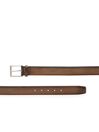 The Magnanni Viento Belt in Torba features brown calfskin leather and a silver rectangular buckle, displayed from angled and flat views.