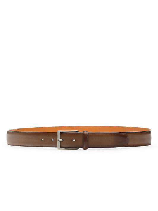 The Magnanni Viento Belt in Torba is a men’s brown leather dress belt with a sleek silver rectangular buckle, shown elegantly on a white background.