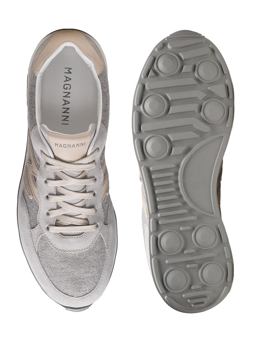 Top and bottom views of the Magnanni Yoki in Metal Suede & Bone, a retro-inspired sneaker made in Spain with light grey suede and leather panels, white laces, and an athletic-style textured grey rubber sole.