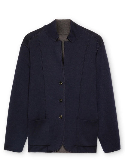 The Maurizio Baldassari Jamaica Reversible Wool Swacket in Nightshadow Blue is crafted from soft merino wool and features a stand collar, button closure, and two front patch pockets, displayed against a plain white background.
