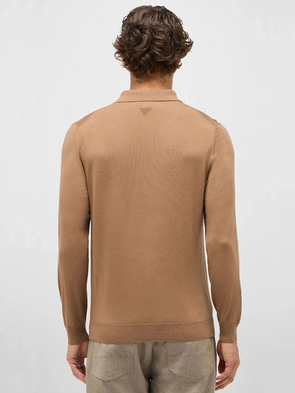 A person with short, wavy brown hair is seen from behind wearing the Maurizio Baldassari 3-Button Long Sleeve Extrafine Wool Polo in Camel and light beige pants against a plain light background.