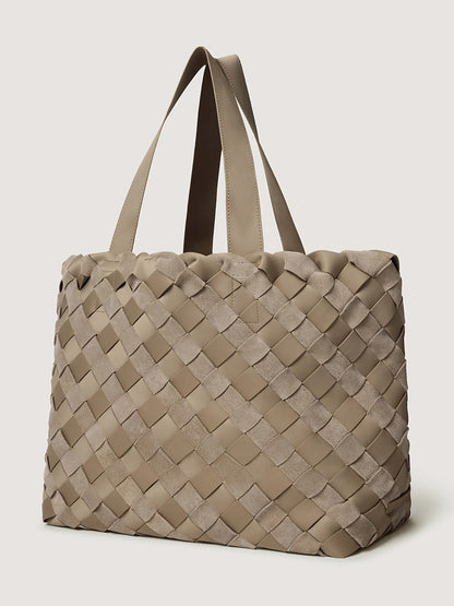 Naghedi Como Medium Tote Suede & Neoprene in Bluff, a taupe handwoven tote with alternating smooth and Italian suede-textured exterior strips and two shoulder straps.