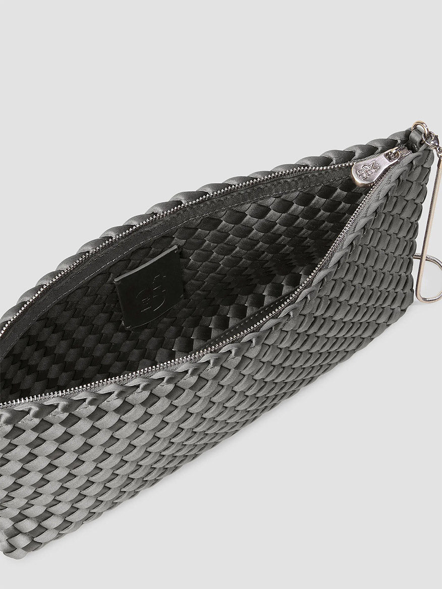Naghedi Gala Clutch Satin in Graphite, a dark grey woven evening bag with a zippered top.