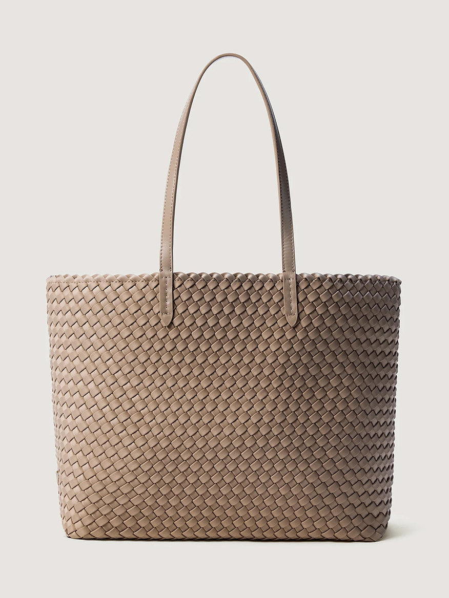 A beige handwoven neoprene Naghedi Jetsetter Small Tote in Cashmere with two shoulder straps, perfect as a travel essential.