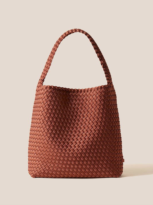 Handwoven Naghedi Nomad Hobo in Solid Adobe tote bag against a neutral background.