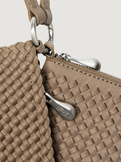 Naghedi Orly Phone Case in Cashmere, a tan woven crossbody pouch with a silver zipper closure and a matching detachable strap.