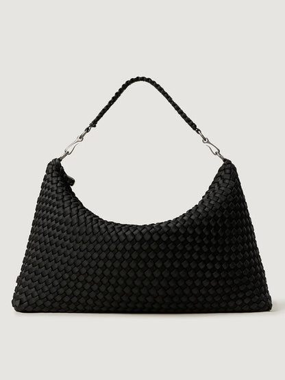 The Naghedi Porto Medium Half-Moon Bag in Onyx is a black handwoven shoulder bag with a short handle and silver hardware, shown against a plain light background.