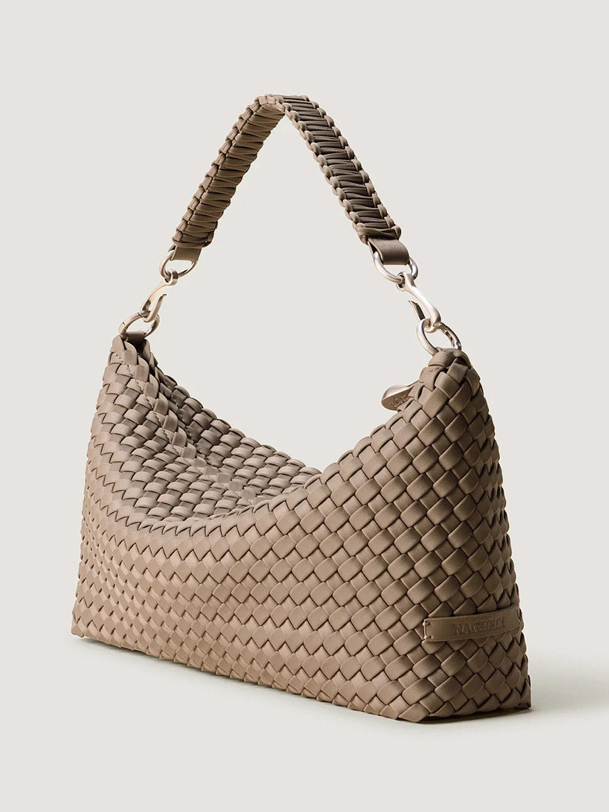 Naghedi Porto Medium Half-Moon Bag in Cashmere: a taupe, half-moon handwoven neoprene shoulder bag featuring a braided handle.