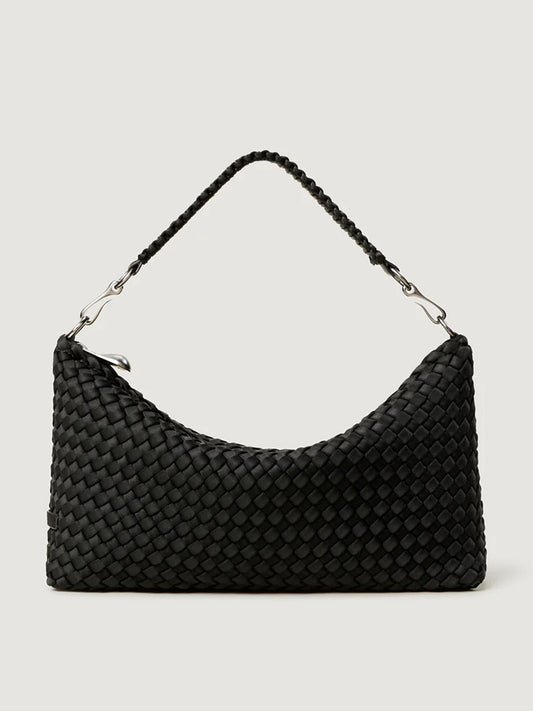 The Naghedi Porto Small Half-Moon Bag in Onyx features a black handwoven neoprene design, a single braided strap, and silver-tone hardware, shown against a plain light background.