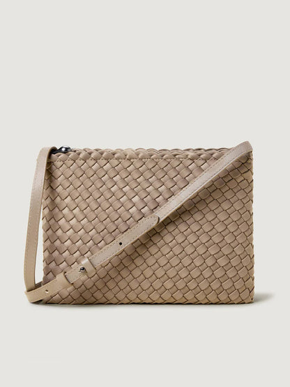 The Naghedi Soho Envelope Crossbody in Cashmere features tan woven neoprene and an adjustable leather strap, shown against a light background.
