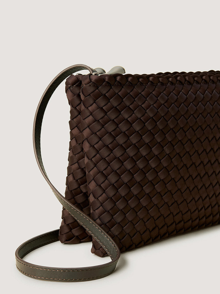 Dark brown handwoven neoprene Naghedi Soho Envelope Crossbody in Chocolate with an adjustable slim shoulder strap.