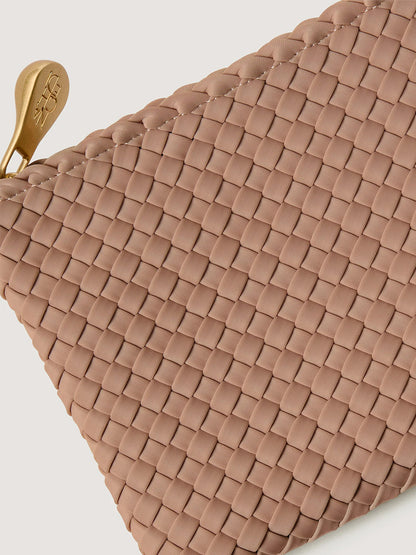 Close-up of a tan neoprene Naghedi St. Barths Medium Tote in Seychelles everyday carryall pouch with a gold-tone zipper pull.