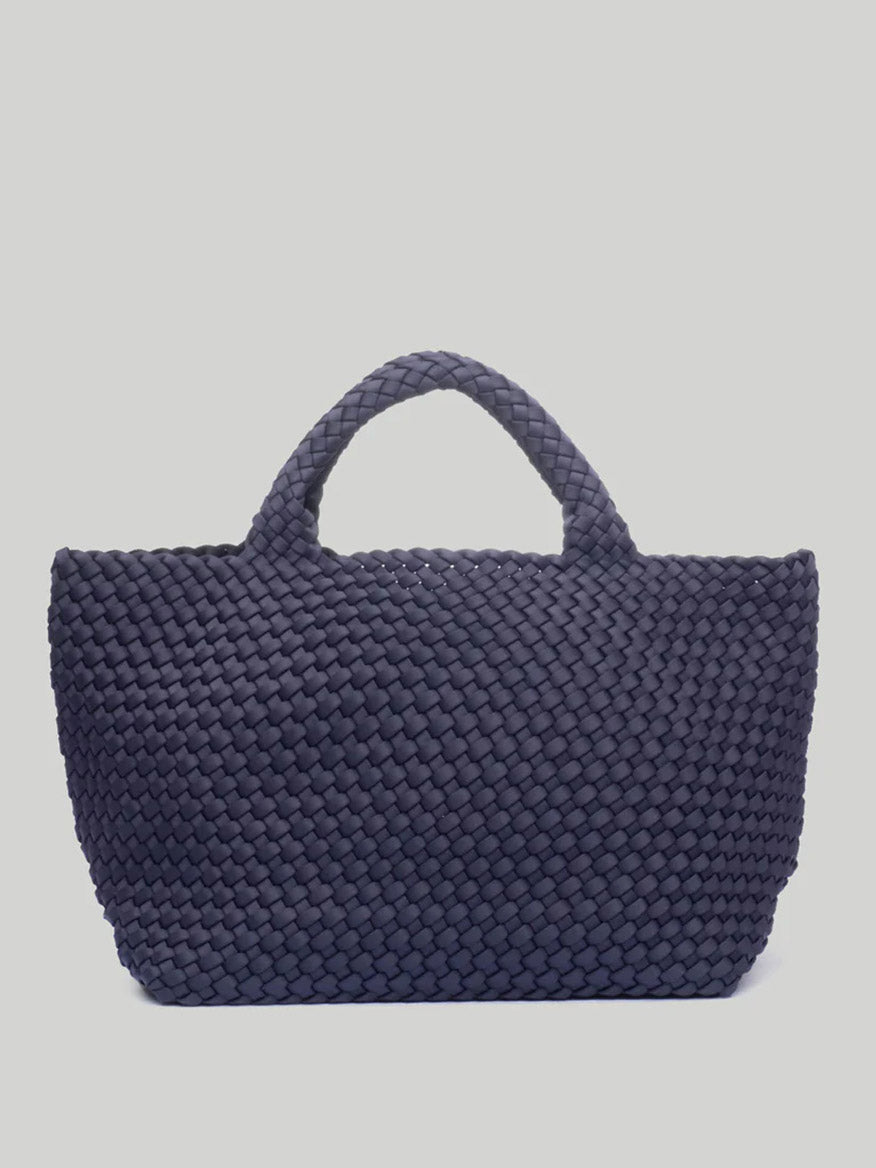 A Naghedi St. Barths Medium Tote in Solid Ink Blue neoprene design, featuring two sturdy handles, set against a plain light background.