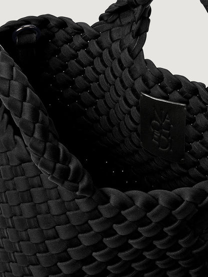 Naghedi St. Barths Petit Tote in Onyx, a handwoven neoprene mini tote bag in black featuring a small interior brand tag.