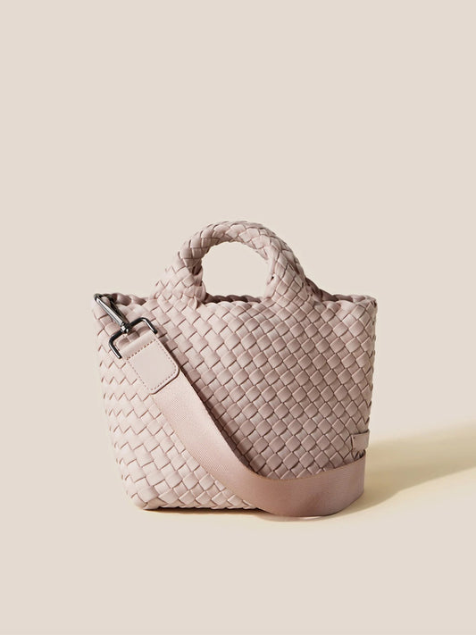 Naghedi St. Barths Petit Tote in Solid Shell Pink with crossbody strap against a neutral background.