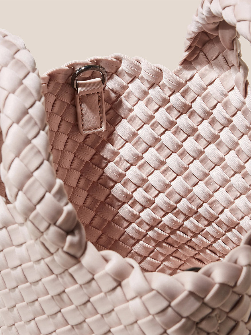 Detailed view of a Naghedi St. Barths Petit Tote in Solid Shell Pink with a close-up on the texture and craftsmanship.
