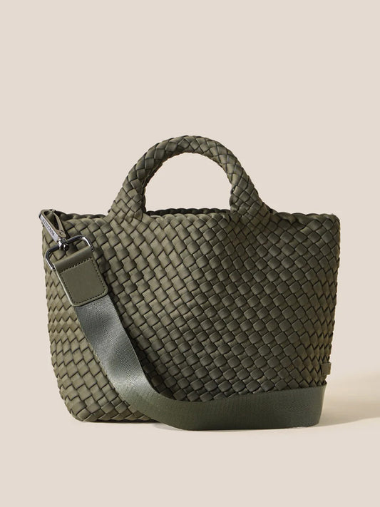 The Naghedi St. Barths Small Tote in Solid Olive features a handwoven neoprene design, comes with a short handle and a long crossbody strap, set against a plain background.