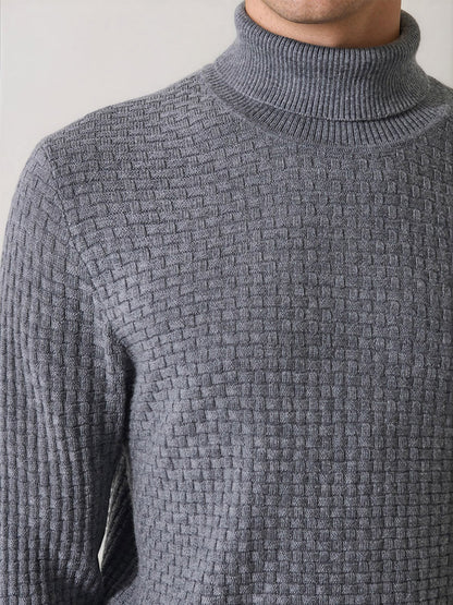 A person wearing the Patrick Assaraf Extra-Fine Merino Wool Basketweave Turtleneck in Castlerock, shown from the shoulders to the upper chest against a neutral background.