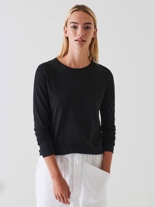 A woman in a Patrick Assaraf Lightweight Pima Cotton T-Shirt in black.