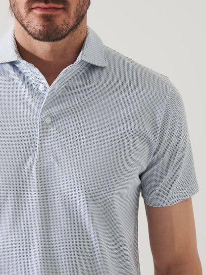 Close-up of a man wearing a Patrick Assaraf Pima Cotton Stretch Printed Polo in New Oman Micro Diamond Dot, short sleeve button-up shirt focusing on the chest and neck area, without displaying the face.