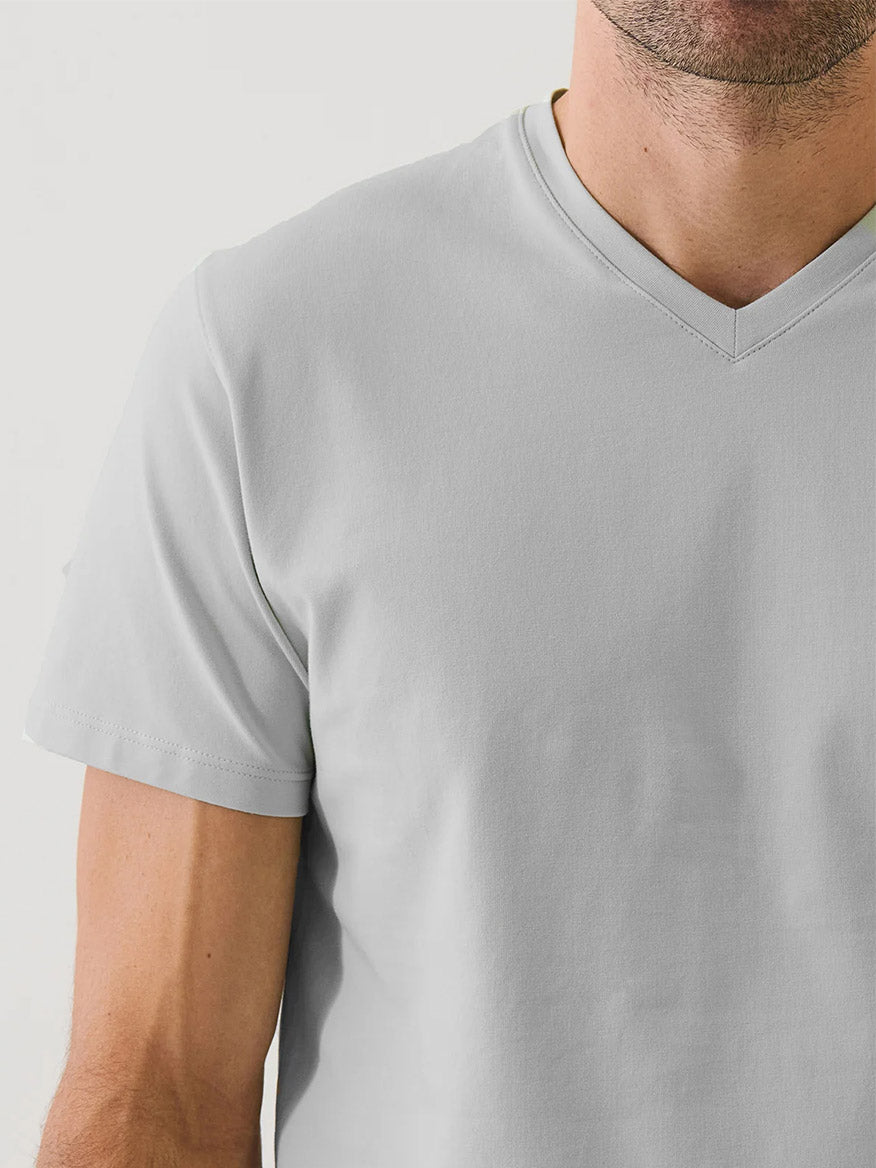 A man wears the Patrick Assaraf Pima Cotton Stretch V-Neck T-Shirt in Mellow Grey, shown from shoulders to mid-torso against a plain background.