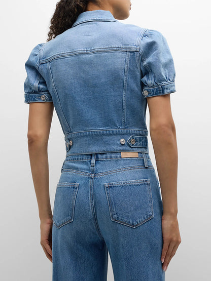 Woman seen from behind wearing a Paige Kendra Puff Short Sleeve Jacket in Lowen and jeans, focusing on the back and waist details.