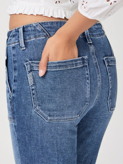 A hand slipping into a rear utility patch pocket of a pair of Paige Mayslie Straight Ankle in Rock Show blue denim jeans.