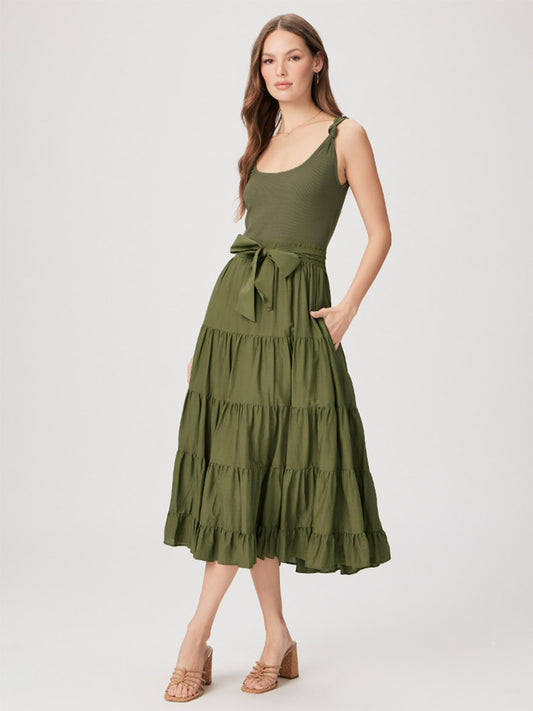 Woman wearing a Paige Samosa Dress in Dark Olive with a sash and heeled sandals.