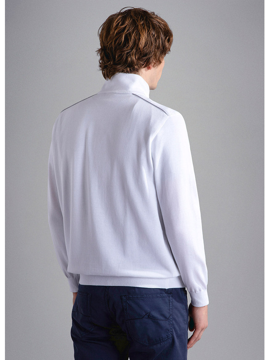 Man standing with his back to the camera, wearing a Paul & Shark Fresco Cotton Sweater With Linen Details in White and dark trousers.