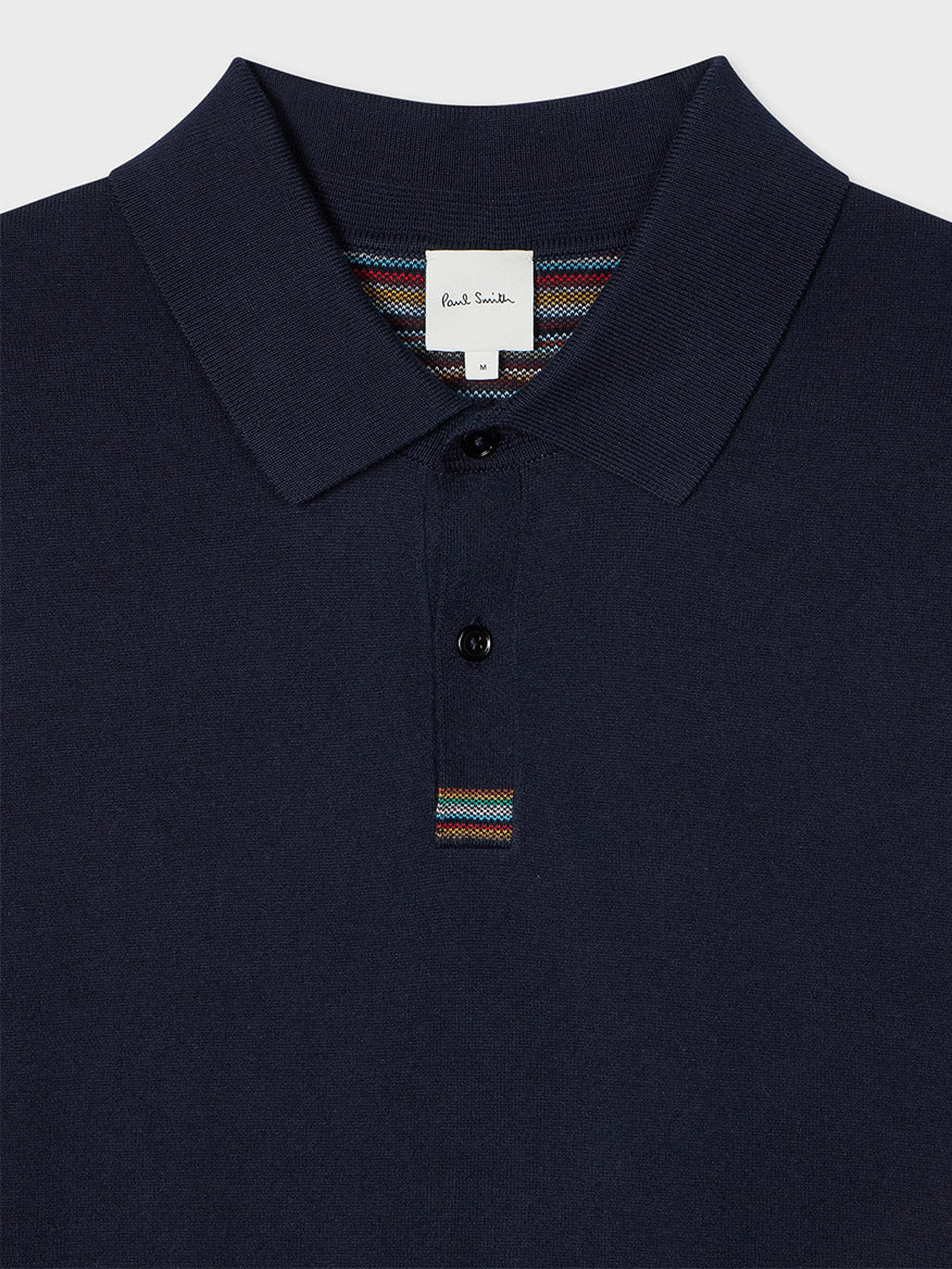 The Paul Smith Knitted Cotton 'Signature Stripe' Trim Polo Shirt in Navy features a collar, two-button placket, and bold Signature Stripe detailing.