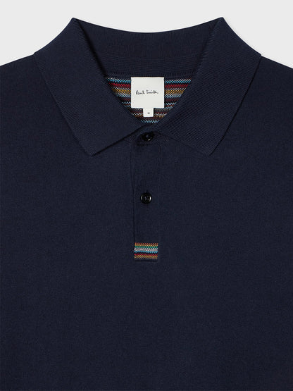 The Paul Smith Knitted Cotton 'Signature Stripe' Trim Polo Shirt in Navy features a collar, two-button placket, and bold Signature Stripe detailing.