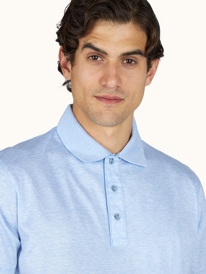 Man with short wavy hair wears the Paul & Shark Polo Jersey Shirt With Linen Details in cerulean, facing forward against a plain background.