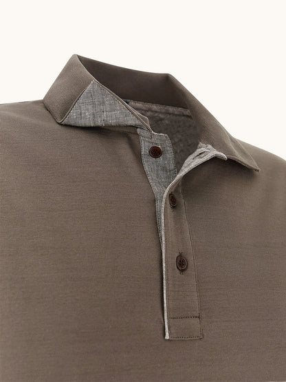 Close-up of a Paul & Shark Polo Jersey Shirt With Linen Details in Morel, featuring a button placket and contrasting inner collar lining for a refined touch.