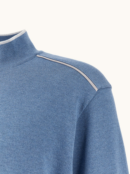 Close-up of the Paul & Shark Half‑Zip Sweater With Aqualeather Suede Details in Colony Blue, featuring a mock neck, light grey stripe along the shoulder seam, and signature Shark label.