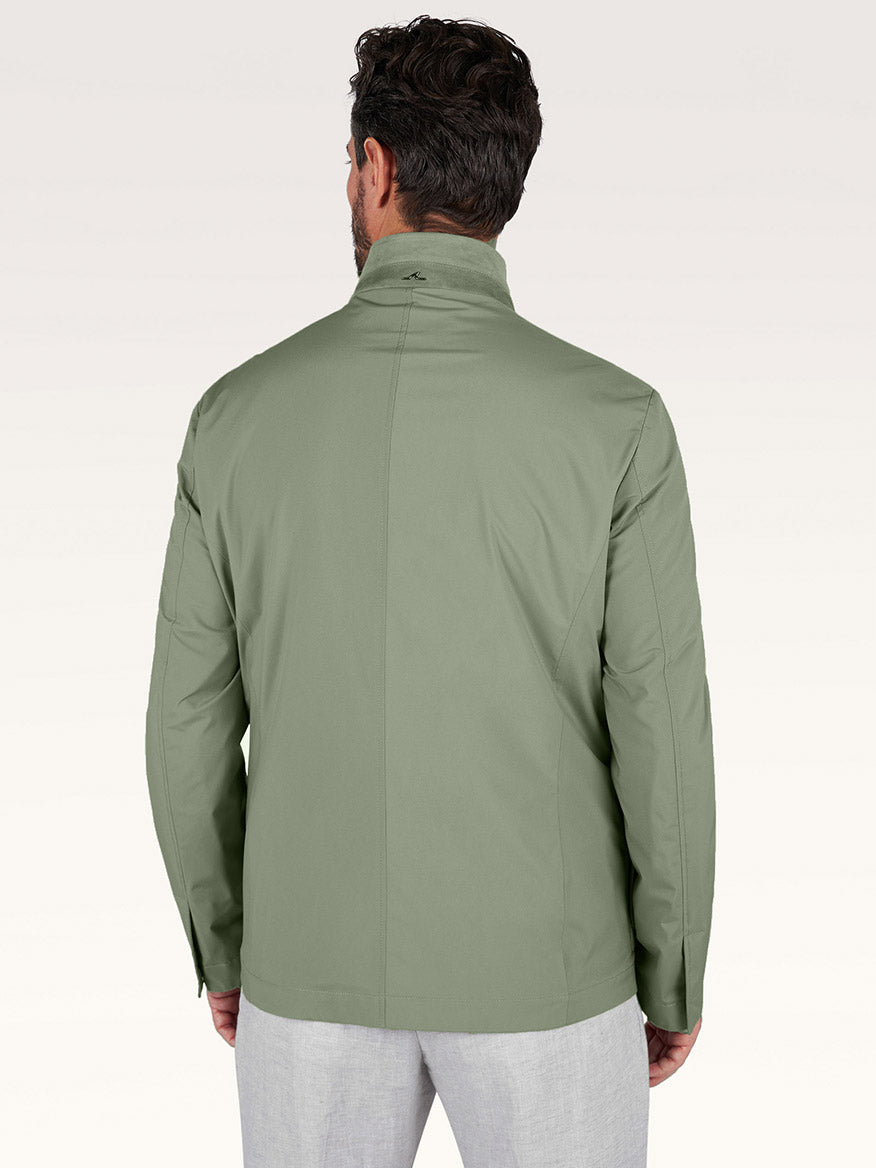 A man is seen from behind wearing the Paul & Shark Typhoon® Platinum Car Coat with Aqualeather suede details in olive and light gray pants, set against a plain background.