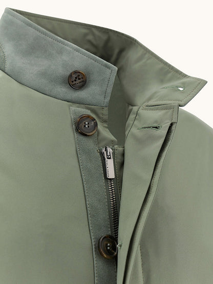 Close-up of the Paul & Shark Typhoon® Platinum Car Coat with Aqualeather suede details in olive, featuring button and zipper closures, a stand collar, and contrasting inner fabric.