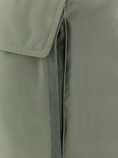 Close-up of the Paul & Shark Typhoon® Platinum Car Coat with Aqualeather suede details in olive, featuring a flap, vertical opening, and visible stitching.