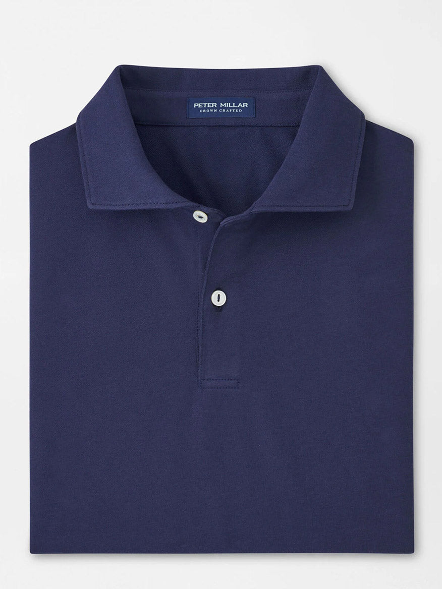 The Peter Millar Albatross Cotton Blend Piqué Polo in Navy is a neatly folded shirt featuring a classic collar, two buttons, and the signature "Peter Millar" label inside the neckline.