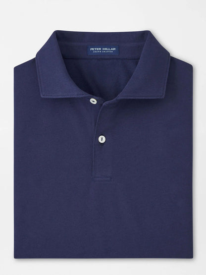 The Peter Millar Albatross Cotton Blend Piqué Polo in Navy is a neatly folded shirt featuring a classic collar, two buttons, and the signature "Peter Millar" label inside the neckline.
