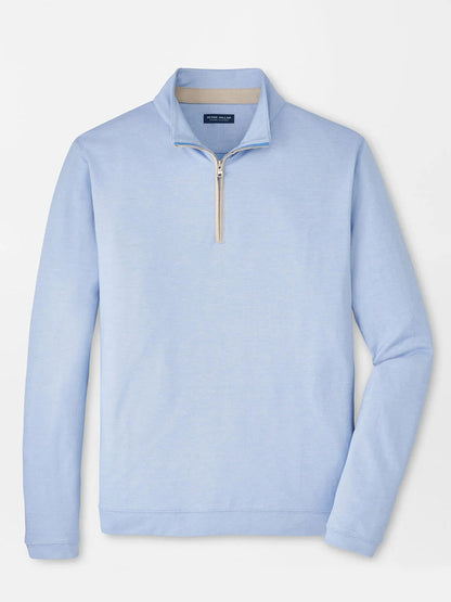 The Peter Millar Albatross Cotton-Blend Piqué Quarter-Zip in Dusk Blue features textured piqué fabric, a stand-up collar, and a beige zipper, shown laid flat on a white background.
