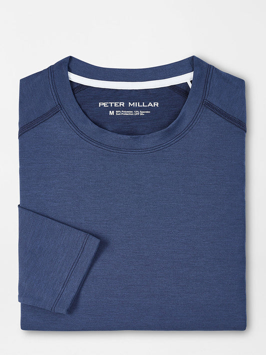 Folded Peter Millar Aurora Performance Long-Sleeve T-Shirt in Navy on a flat surface.
