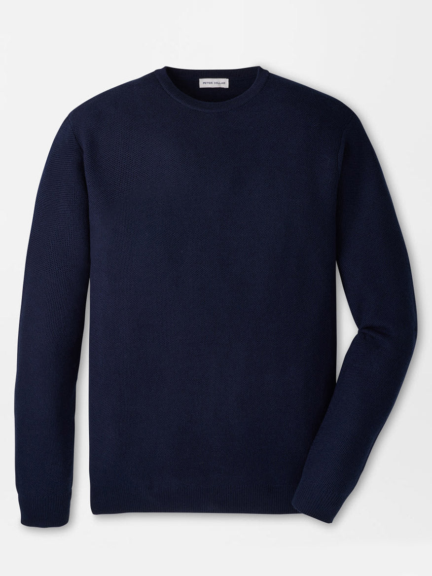 The Peter Millar Autumn Crest Honeycomb Crewneck Sweater in Navy, featuring long sleeves and a classic fit, is laid flat on a white background.